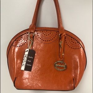 Sorrentino Oval Structured Satchel Handbag
NWT